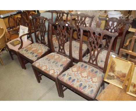 A set of six carved mahogany Chippendale style dining chairs