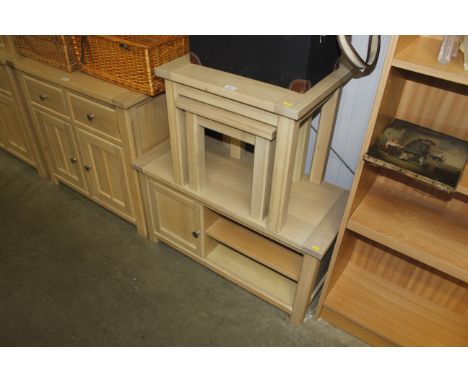 A modern light wood nest of two occasional tables and a television stand