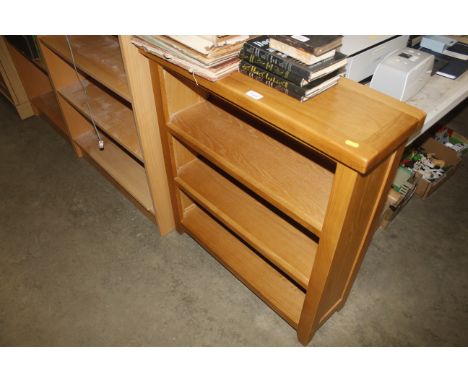 A modern light oak open fronted bookcase 