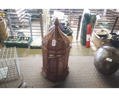 A hanging pierced metal Moroccan style lantern (36) 