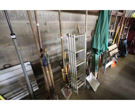 A quantity of tools to include shovel, digging fork, garden shears etc.