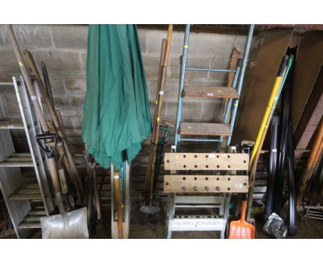 A quantity of gardening tools to include rake, digging fork, spade etc.