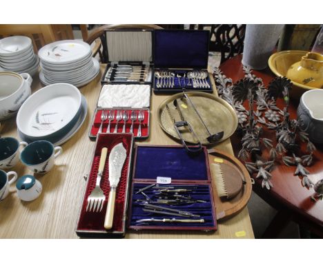 A pair of plated asparagus servers, a plated ladle,  a collection of various other miscellaneous cutlery and a drawing set et