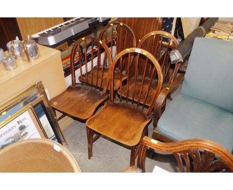 A set of four Ercol stick back kitchen chairs