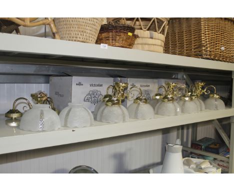 A collection of modern three branch light fittings, some with original boxes