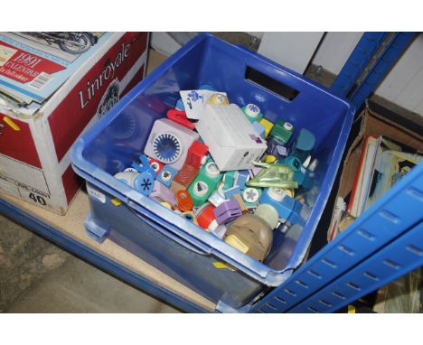 A box of various cutting tools, stationery stamps etc.