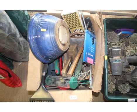 A blue glazed planter, hanging bird feeder, wooden mallet, wicker basket, various gardening tools etc.