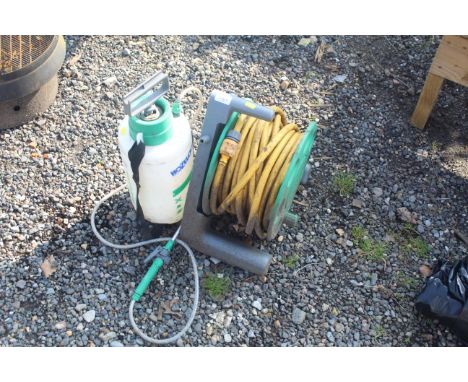 A Hozelock hose reel, length of hose and a Hozelock garden sprayer
