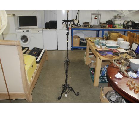 A wrought metal standard lamp