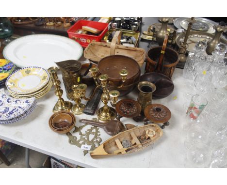 A quantity of various brassware, wooden candle holders, a trug etc.