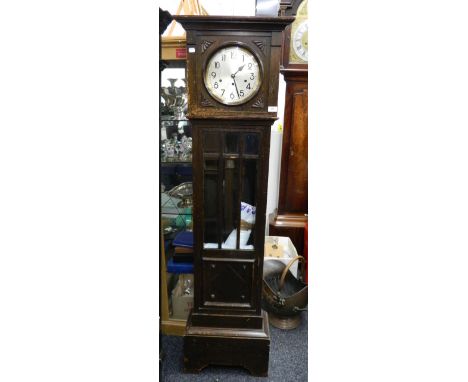 An early 20th century oak longcase clock