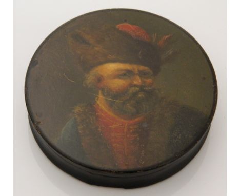 A 19th century papier mache snuff box depicting a Russian gentleman