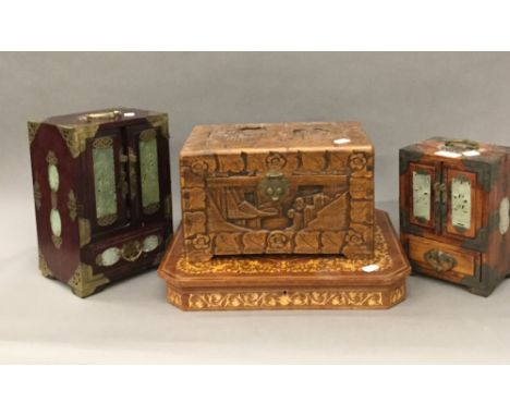 Two jade fronted jewellery boxes, a carved wooden box and a music box