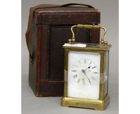 A 19th century brass case carriage clock housed in original travelling case