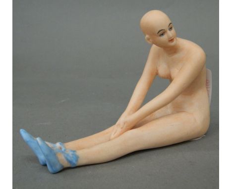 A porcelain figure of a nude lady