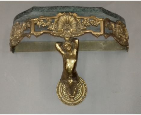 A marble topped brass wall mounted console table