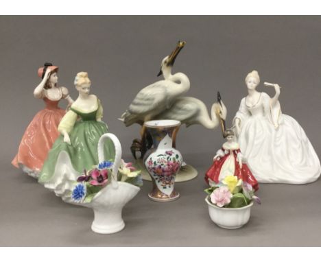 A quantity of ceramic figurines, including Royal Doulton, Coalport and a Samson vase