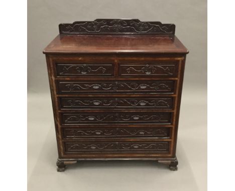 A Chinese carved hardwood chest of drawers