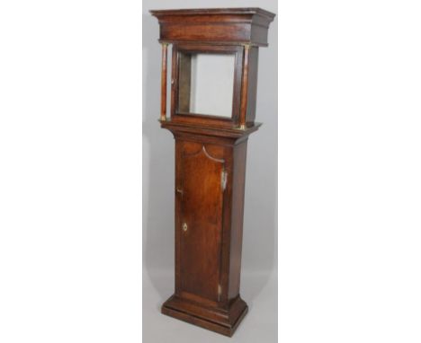 A 19thC oak longcase clock case, transferred into a cabinet, revealing fitted shelves on a shaped base, 156cm high, 52cm wide