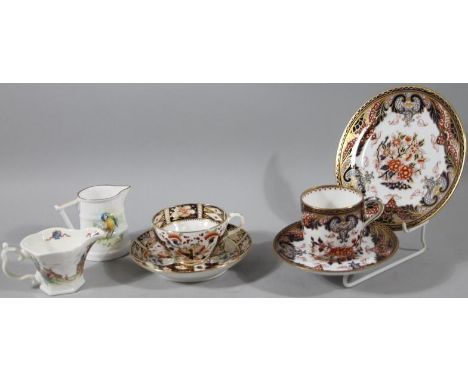 A 19thC Derby Imari style cup and saucer, 15cm dia. D and crown mark beneath, a TA & SG Imari trio and two reproduction Royal