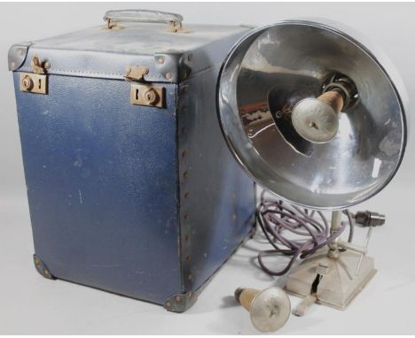 A mid 20thC chrome plated heat lamp, with wide shade, fluted metal stem and attachment in pressed blue leather finish travell