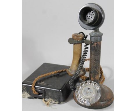 An early 20thC candlestick telephone, with shaped ear piece, metal stem and chrome plated articulated front, 32cm high, on a 