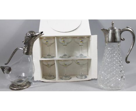 A modern novelty glass decanter, with duck head spout, stylised feather handle and tail, on circular foot with textured glass