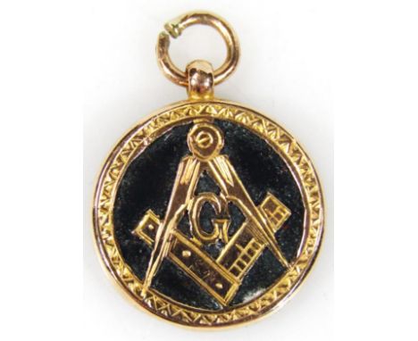 A 9ct gold and jade Masonic related pendant, with compass and set square centred by a capital G with hook top, tested to 9ct,