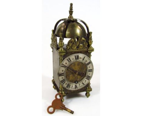 A 20thC lantern clock, by Asprey London, with silvered 7cm dia. dial in a domed case, with key wind movement, named to the fa