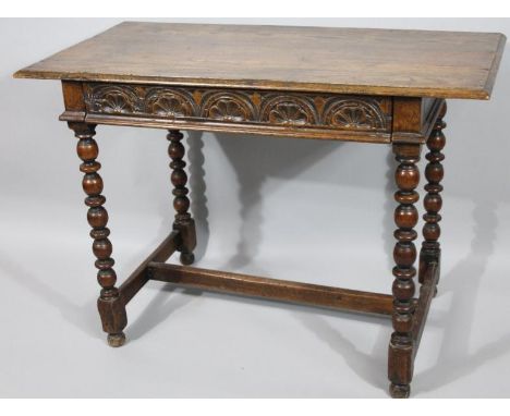 A principally 18thC oak side table, the rectangular top above a carved frieze drawer and bobbin turned supports joined by a p