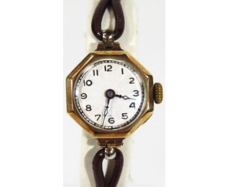 A ladies cocktail watch, the circular Arabic dial with a mother of pearl finish back attached to a black leatherette strap, a