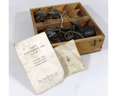 An early 20thC ship's log, in light wood case, containing various pieces, ephemera, etc, the main body 15cm long, with dial f