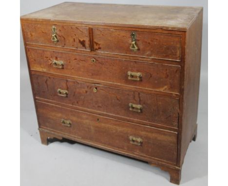 An early 19thC oak chest, of two short and three long drawers on ogee bracket feet, with (replacement) handles, 92cm high, 98