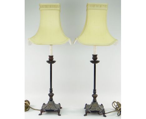 PAIR OF CAST METAL CANDLESTICK TABLE LAMPS with ivory silk shades, overall 74cms high (2)