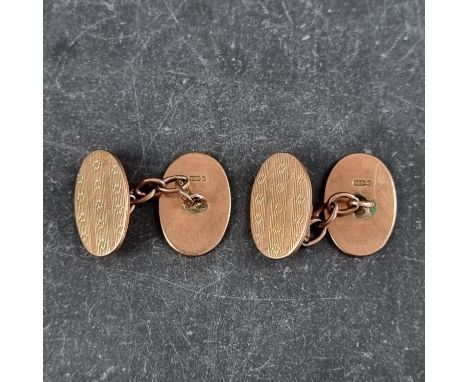 A pair of 9ct gold engine turned cufflinks, 10g. 