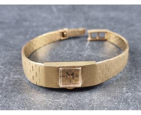 A vintage Accurist 9ct gold manual wind ladies wristwatch, 11mm, import mark London 1973, on original integrated bracelet. 