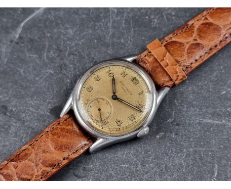 A 1940s Movado 'Sport' stainless steel manual wind wristwatch, 34mm, Ref. 6802, on later brown leather strap. 