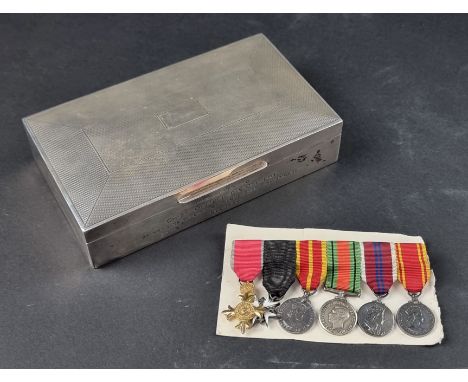 An engine turned silver mounted cigarette box,&nbsp;having engraved presentation, by&nbsp;Harman Brothers, Birmingham 1954, 1
