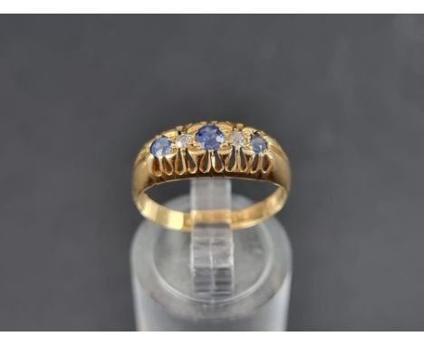 An 18ct gold diamond and sapphire five stone ring, Birmingham 1921, size M 1/2, gross weight 2.4g. 