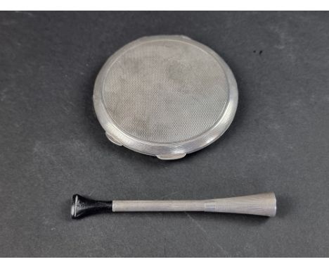 An engine turned silver compact, by&nbsp;M Wachenheimer &amp; Co Ltd, Birmingham 1941, 7.5cm diameter; together with an engin