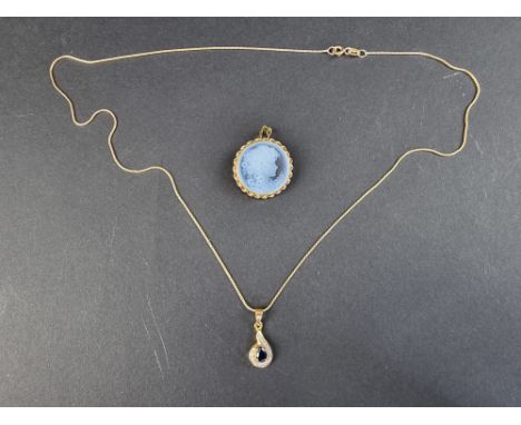 A yellow metal mounted carved intaglio pendant, stamped 750, 24mm diameter; together with a chain, stamped 750, with attached