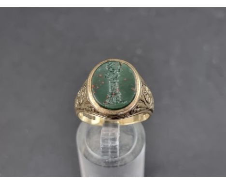 A 9ct gold signet ring set oval intaglio carved bloodstone, size Q, gross weight 6.4g. 