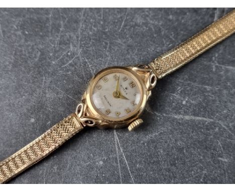 A circa 1958 Rolex 9ct gold manual wind ladies wristwatch, 17mm, Chester 1958, on 9ct gold bracelet. 