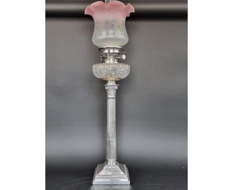 An Edwardian silver Corinthian column oil lamp, by Mappin and Webb, Sheffield 1906, height to top of oil reservoir 52.5cm. 