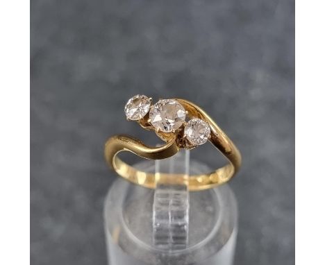 An 18ct gold diamond three stone ring,&nbsp;the principal stone approximately 0.25ct, size L, Chester 1908, gross weight 3.3g