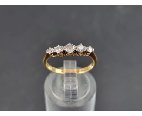 A yellow metal diamond five stone ring, stamped 18ct/Plat, size M 1/2. 