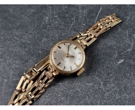 A vintage Rotary 9ct gold manual wind ladies wristwatch, 16mm, London 1970, on 9ct gold bracelet. 