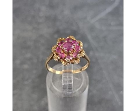 A 9ct gold pink topaz cluster ring, size P, gross weight 3g. 