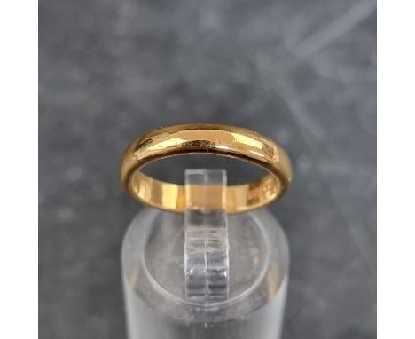 A 22ct gold wedding band, Birmingham 1937, size K 1/2, 4.8g. 