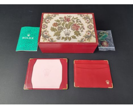 A 1980s Rolex 'Tapestry Red' wristwatch case, Ref. 60.01.2; together with a Rolex 'Oyster' Chronometer certification, Rolex h